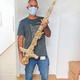 Scuba diver Shlomi Katzin brandishing the sword he found.